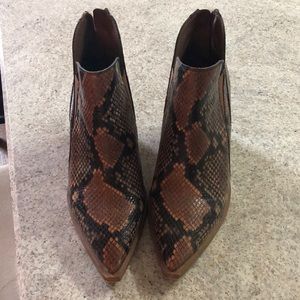 Vince Camuto snakeskin booties.